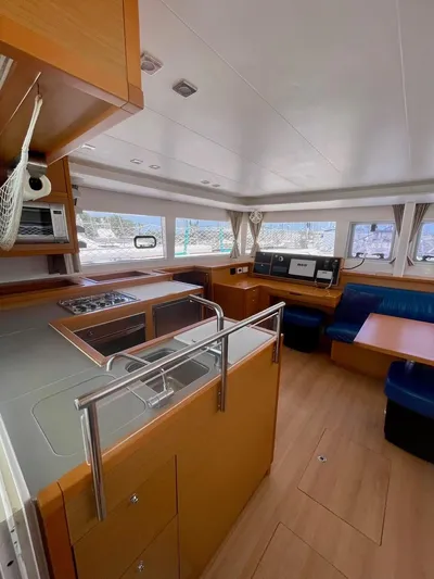Unfettered Yacht Photos Pics 2015 Lagoon 450 F yacht interior with modern kitchen and seating area.