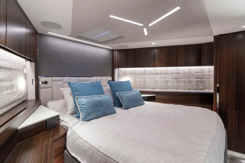 Baillies Yacht Photos Pics Luxurious bedroom interior of 2021 Sunseeker Manhattan 68 yacht with modern design.