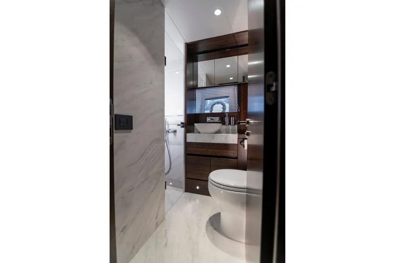 Baillies Yacht Photos Pics Luxurious bathroom interior of 2021 Sunseeker Manhattan 68 yacht, featuring modern fixtures and elegant design.