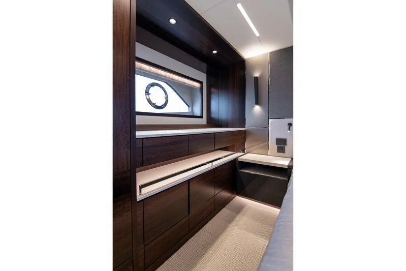 Baillies Yacht Photos Pics Luxurious interior of 2021 Sunseeker Manhattan 68 yacht with sleek wood cabinetry.