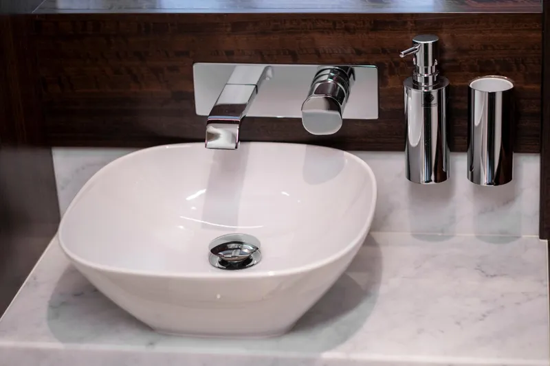 Baillies Yacht Photos Pics Modern bathroom sink with chrome fixtures on Sunseeker Manhattan 68 yacht, 2021 model.