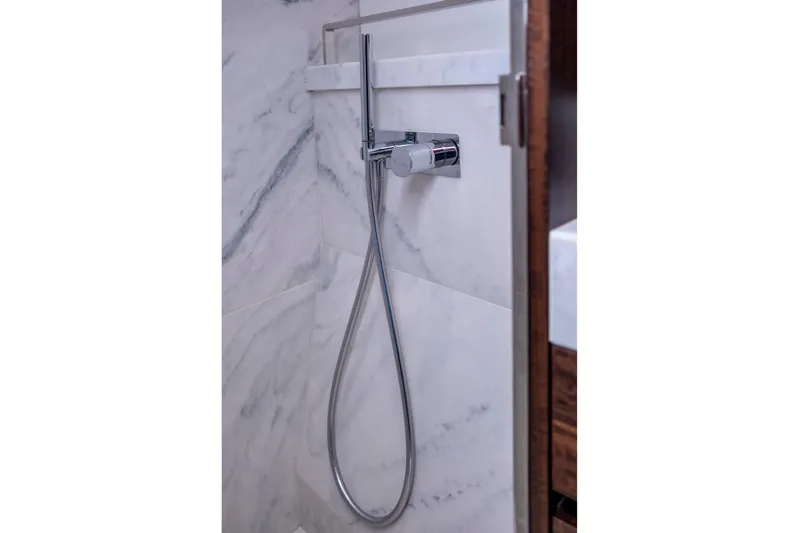 Baillies Yacht Photos Pics Modern shower fixture in Sunseeker Manhattan 68 yacht, 2021 model, with marble wall design.