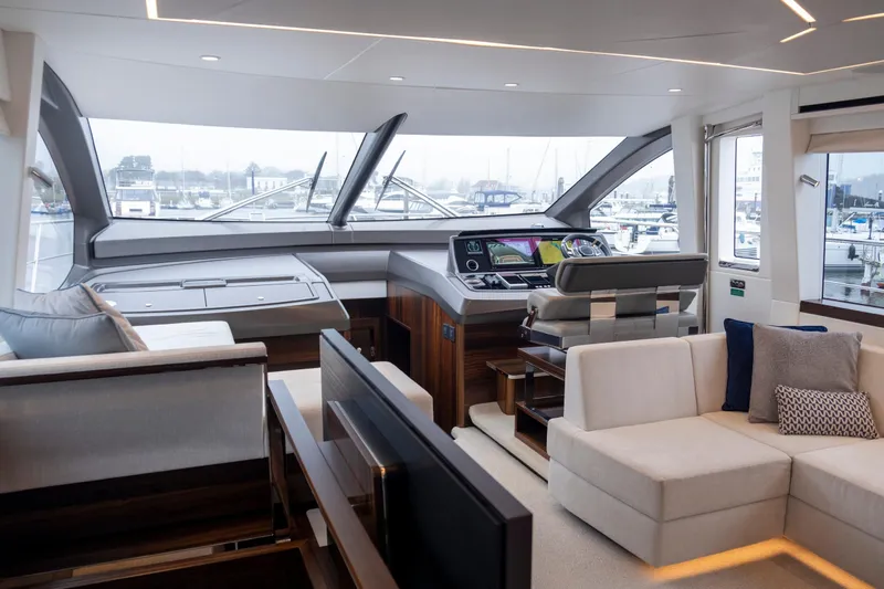Baillies Yacht Photos Pics Luxurious interior of 2021 Sunseeker Manhattan 68 yacht with modern helm and seating area.