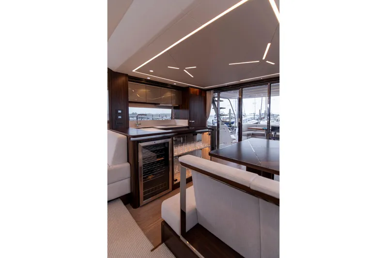 Baillies Yacht Photos Pics Luxurious interior of 2021 Sunseeker Manhattan 68 yacht with modern design and elegant furnishings.