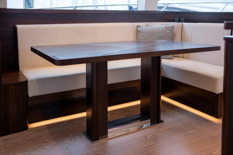 Baillies Yacht Photos Pics Luxurious interior of 2021 Sunseeker Manhattan 68 yacht with elegant dining area.