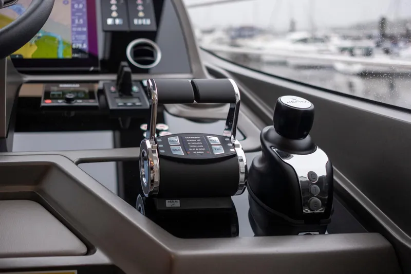 Baillies Yacht Photos Pics Control panel of 2021 Sunseeker Manhattan 68 yacht, featuring throttle and joystick controls.