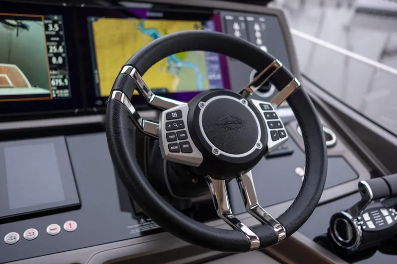 Baillies Yacht Photos Pics Steering wheel and dashboard of 2021 Sunseeker Manhattan 68 yacht.