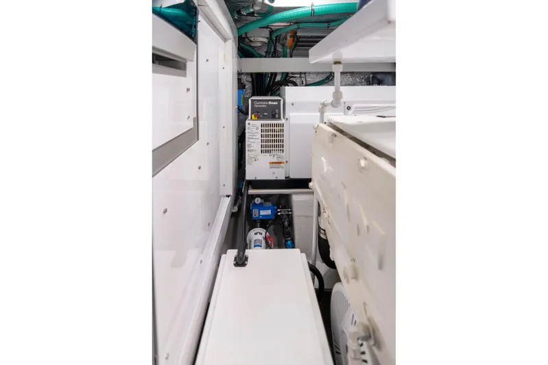 Baillies Yacht Photos Pics Engine room of 2021 Sunseeker Manhattan 68 yacht, featuring Cummins Onan generator.