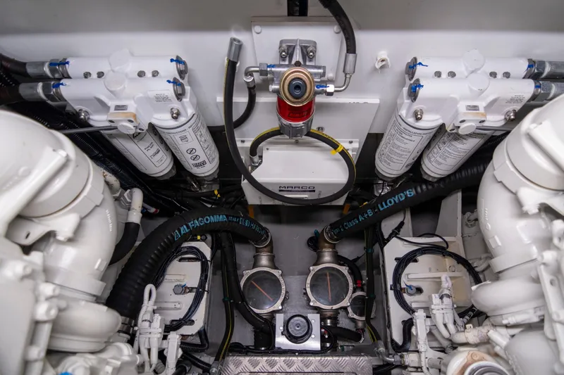 Baillies Yacht Photos Pics Engine room of 2021 Sunseeker Manhattan 68 yacht, showcasing mechanical components and filters.