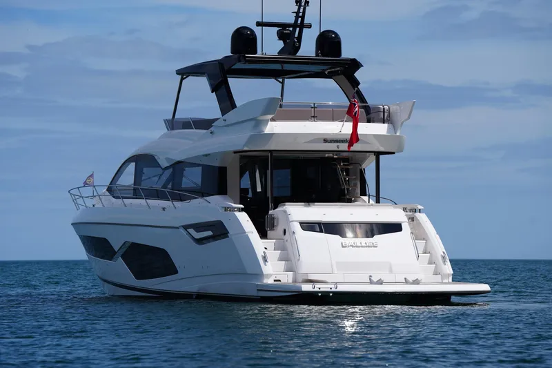 Baillies Yacht Photos Pics 2021 Sunseeker Manhattan 68 yacht on calm ocean waters.