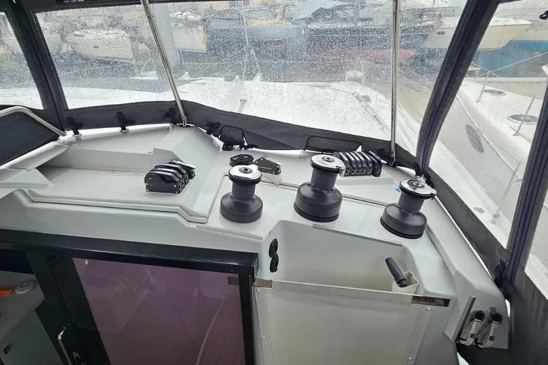 Talila Yacht Photos Pics Cockpit of 2022 Fountaine Pajot Tanna 47 catamaran with winches and controls.