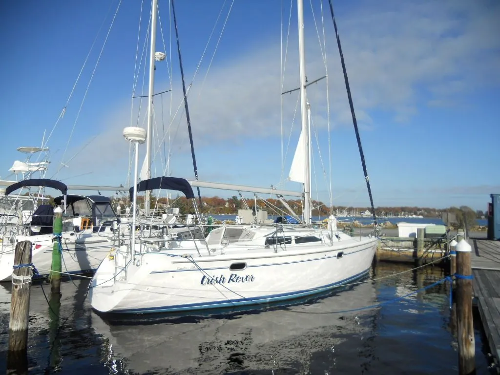 1999 Catalina 320 sailboat docked in a marina.