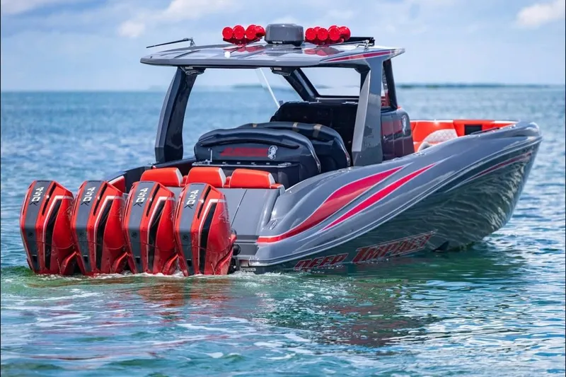  Yacht Photos Pics 2022 Deep Impact 399 Sport boat with quad engines on clear water.