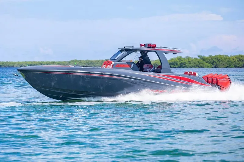  Yacht Photos Pics 2022 Deep Impact 399 Sport boat cruising on clear blue water.