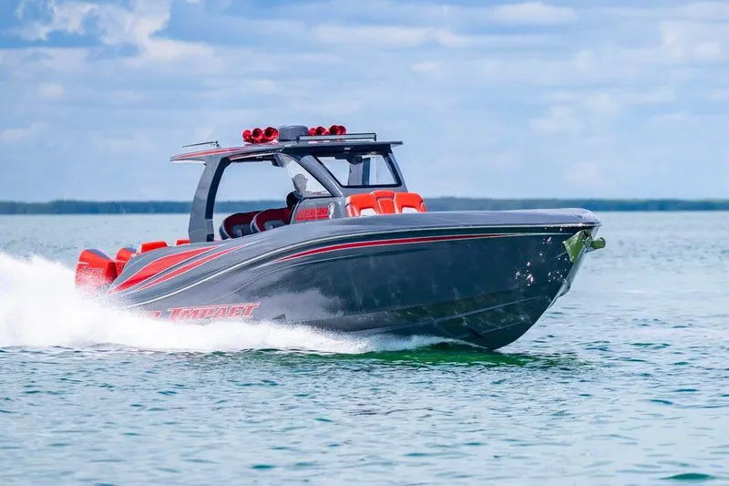  Yacht Photos Pics 2022 Deep Impact 399 Sport boat cruising on open water, showcasing sleek design and speed.