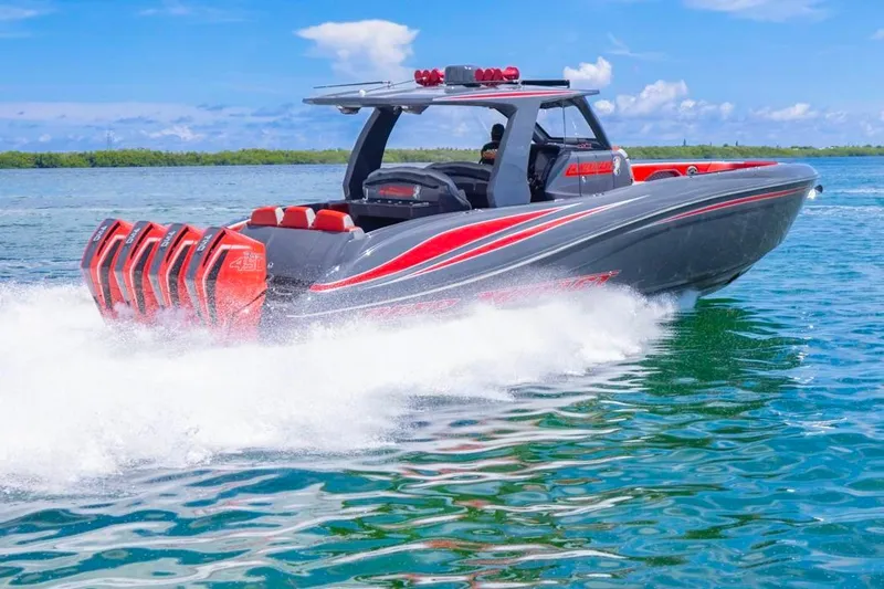  Yacht Photos Pics 2022 Deep Impact 399 Sport boat speeding on water, featuring multiple powerful engines.