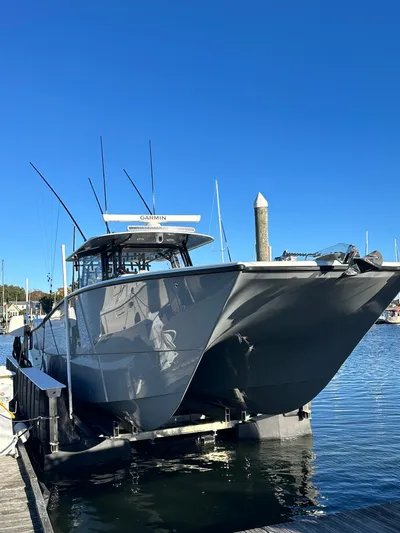  Yacht Photos Pics 2024 Wyatt and Freeman 42LR boat docked at marina under clear blue sky.