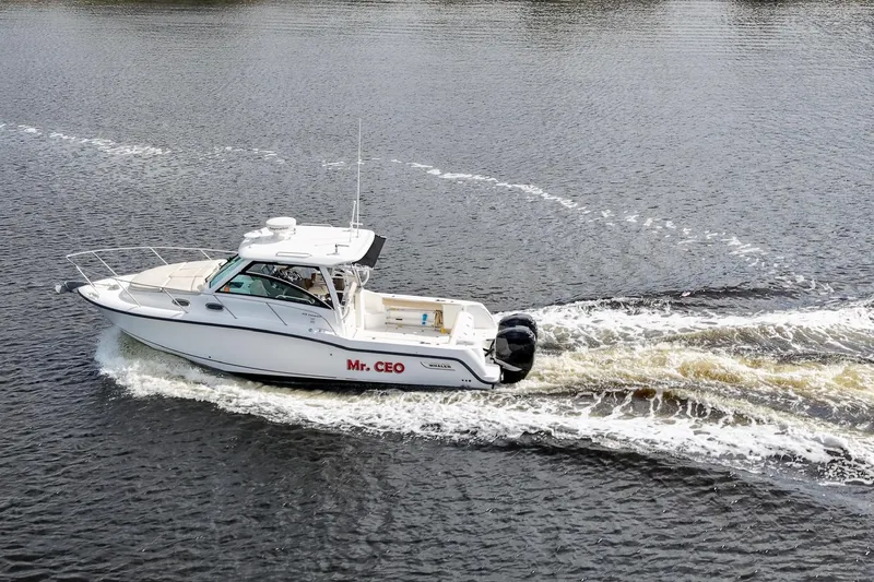Mr Ceo Yacht Photos Pics 2015 Boston Whaler 315 Conquest boat cruising on water, named "Mr. CEO".