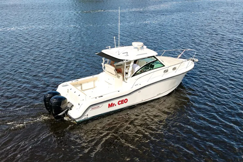 Mr Ceo Yacht Photos Pics 2015 Boston Whaler 315 Conquest boat named "Mr. CEO" cruising on water.