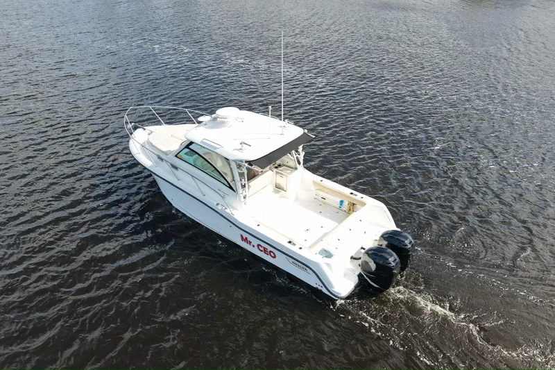 Mr Ceo Yacht Photos Pics 2015 Boston Whaler 315 Conquest boat on open water, aerial view.