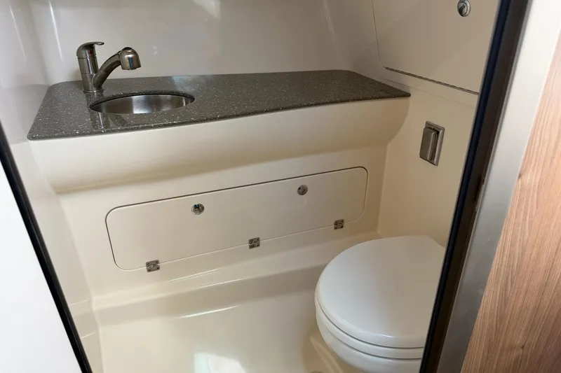 Mr Ceo Yacht Photos Pics 2015 Boston Whaler 315 Conquest bathroom with sink and toilet.
