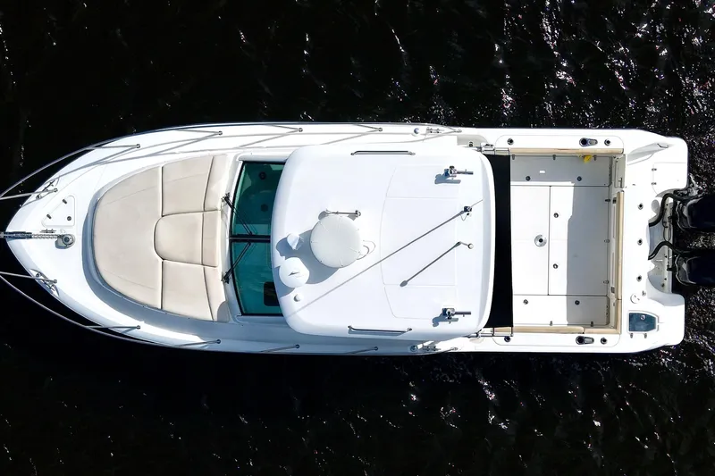 Mr Ceo Yacht Photos Pics Overhead view of 2015 Boston Whaler 315 Conquest boat on dark water.