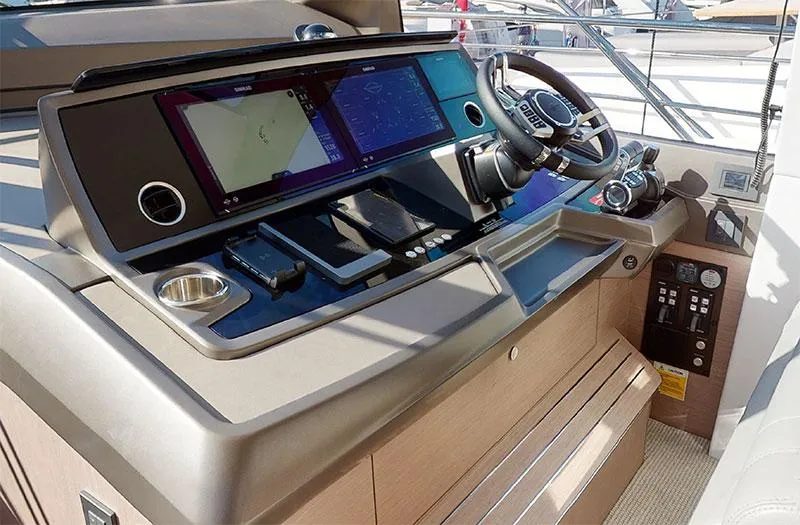  Yacht Photos Pics Control panel of 2022 Sunseeker Manhattan 68 yacht with modern navigation equipment.