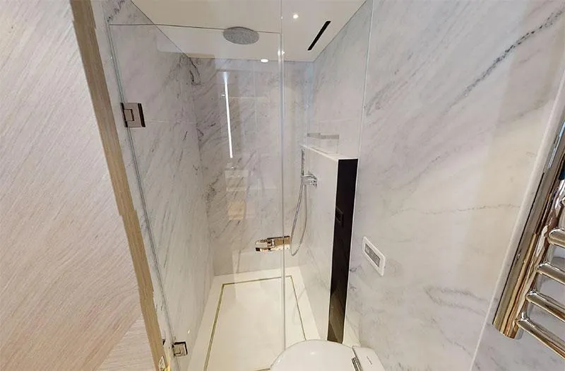  Yacht Photos Pics Luxurious bathroom in 2022 Sunseeker Manhattan 68 yacht with sleek marble design.