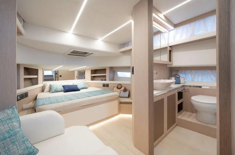 Yacht Photos Pics Luxurious interior of 2025 Apreamare Gozzo 45 yacht with modern bedroom and bathroom.
