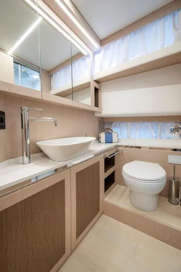  Yacht Photos Pics Luxurious bathroom in 2025 Apreamare Gozzo 45 yacht, featuring modern fixtures and elegant design.