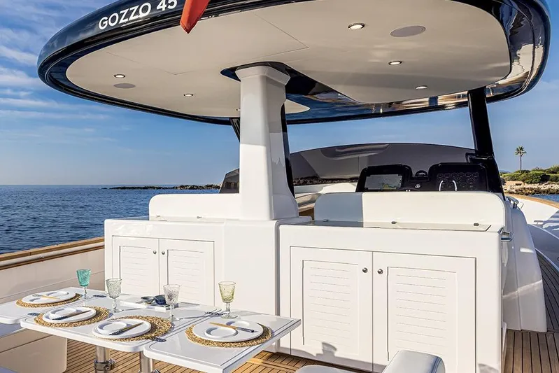  Yacht Photos Pics 2025 Apreamare Gozzo 45 yacht with elegant outdoor dining setup.