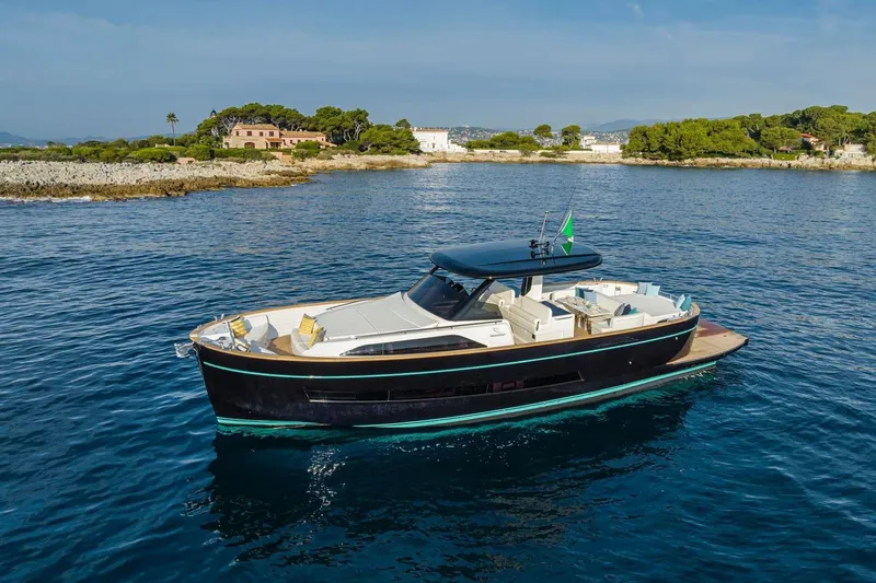  Yacht Photos Pics 2025 Apreamare Gozzo 45 yacht cruising near a scenic coastline.