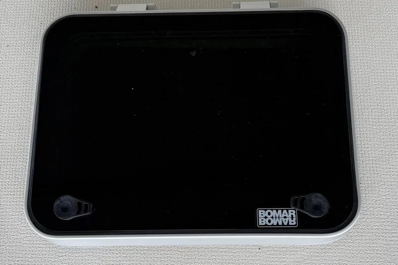  Yacht Photos Pics Bomar hatch on 1996 Riviera 39 Open Flybridge boat, black with white frame.