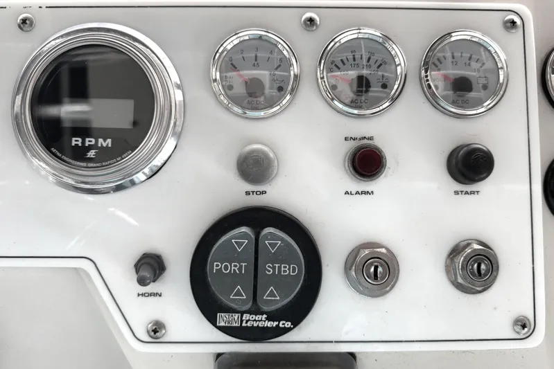  Yacht Photos Pics Control panel of a 1996 Riviera 39 Open Flybridge boat with gauges and switches.