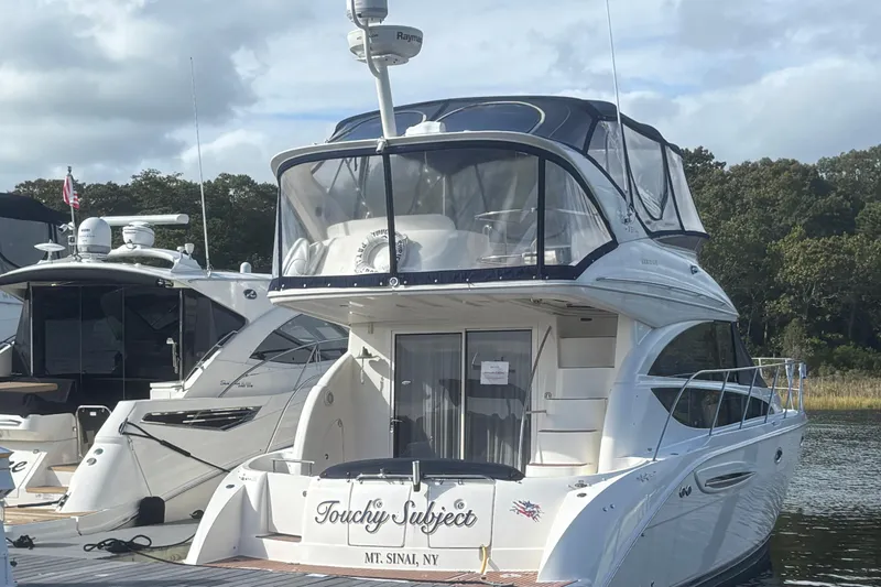  Yacht Photos Pics 2007 Meridian 391 Sedan yacht docked, featuring sleek design and spacious upper deck.