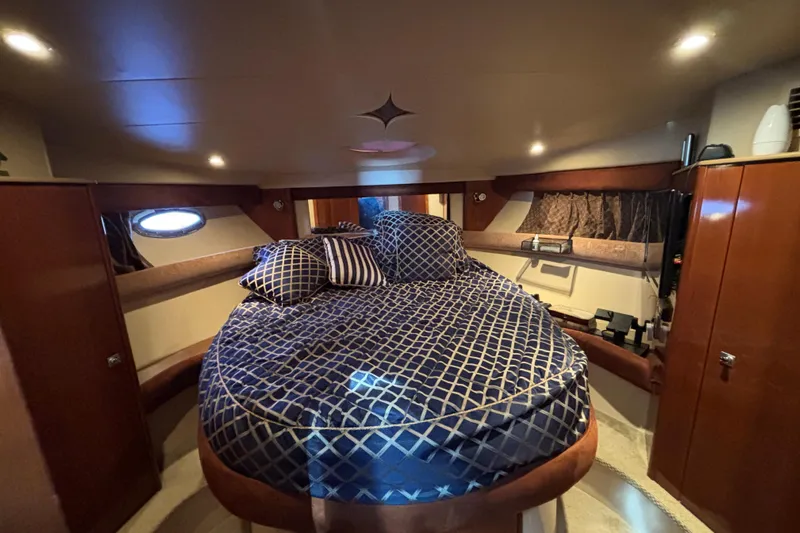  Yacht Photos Pics Luxurious cabin interior of 2007 Meridian 391 Sedan yacht with elegant bedding.