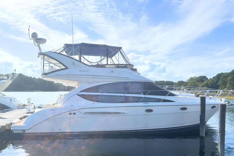  Yacht Photos Pics 2007 Meridian 391 Sedan yacht docked, featuring sleek design and spacious upper deck.