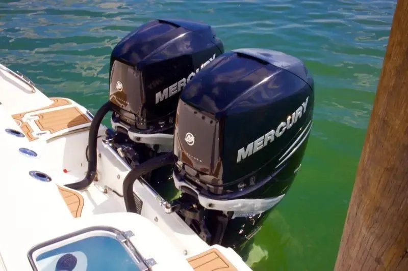  Yacht Photos Pics Twin Mercury outboard engines on a 2013 Boston Whaler 320 Outrage in clear water.