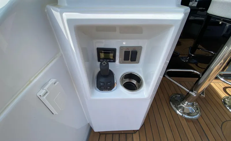 Radiant Yacht Photos Pics Control panel on 2022 Cruisers Yachts 60 Fly, featuring joystick and switches.