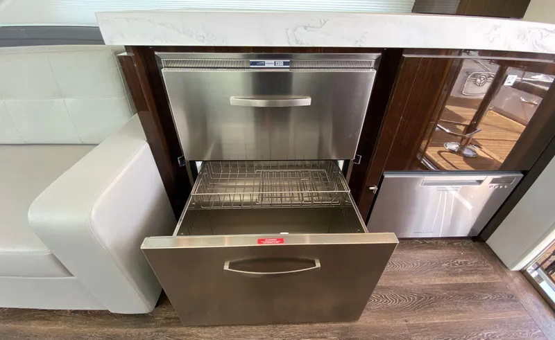 Radiant Yacht Photos Pics Modern kitchen drawers in 2022 Cruisers Yachts 60 Fly, featuring stainless steel design.