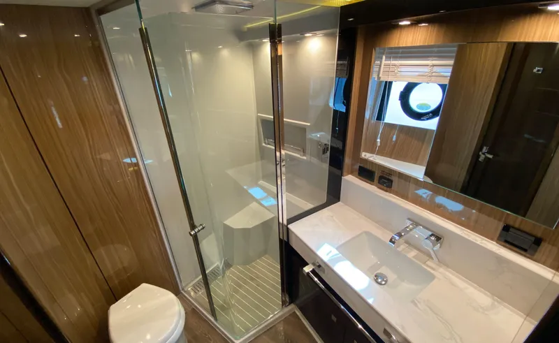 Radiant Yacht Photos Pics Luxurious bathroom in 2022 Cruisers Yachts 60 Fly, featuring modern fixtures and elegant design.