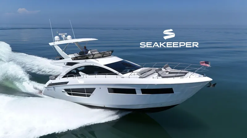 Radiant Yacht Photos Pics 2022 Cruisers Yachts 60 Fly cruising on calm waters with Seakeeper logo.