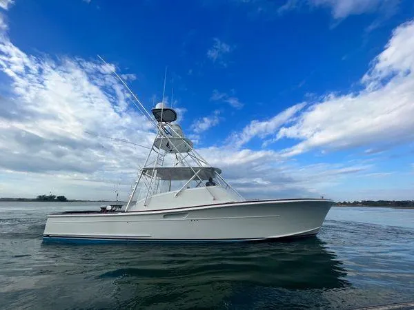 Reel Gratitude Yacht Photos Pics 2014 Release Boatworks 46 Custom Express Carolina on calm water under blue sky.