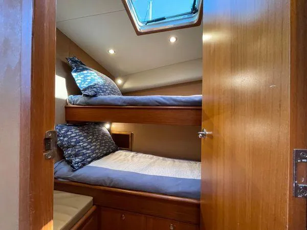 Reel Gratitude Yacht Photos Pics Interior of 2014 Release Boatworks 46 Custom Express Carolina with cozy bunk beds.