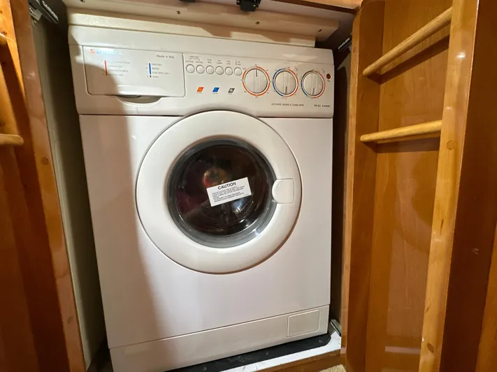  Yacht Photos Pics Washing machine inside a 2002 Carver 466 Motor Yacht wooden cabinet.