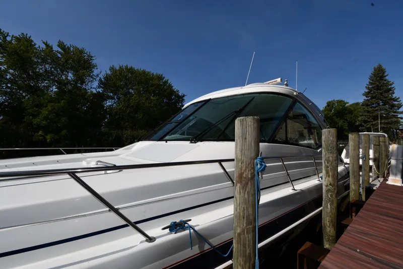  Yacht Photos Pics 2007 Formula 45 Yacht docked, surrounded by trees and clear blue sky.