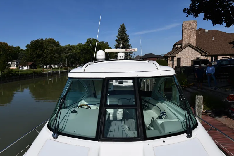  Yacht Photos Pics 2007 Formula 45 Yacht docked by a serene waterfront with clear skies.
