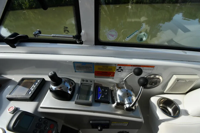  Yacht Photos Pics Control panel of a 2007 Formula 45 Yacht with navigation and throttle controls.