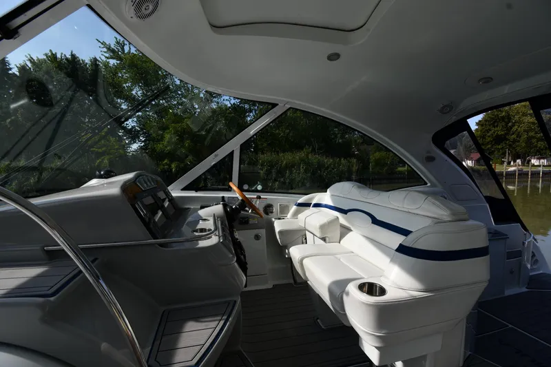  Yacht Photos Pics Interior of 2007 Formula 45 Yacht with sleek white seating and modern dashboard.