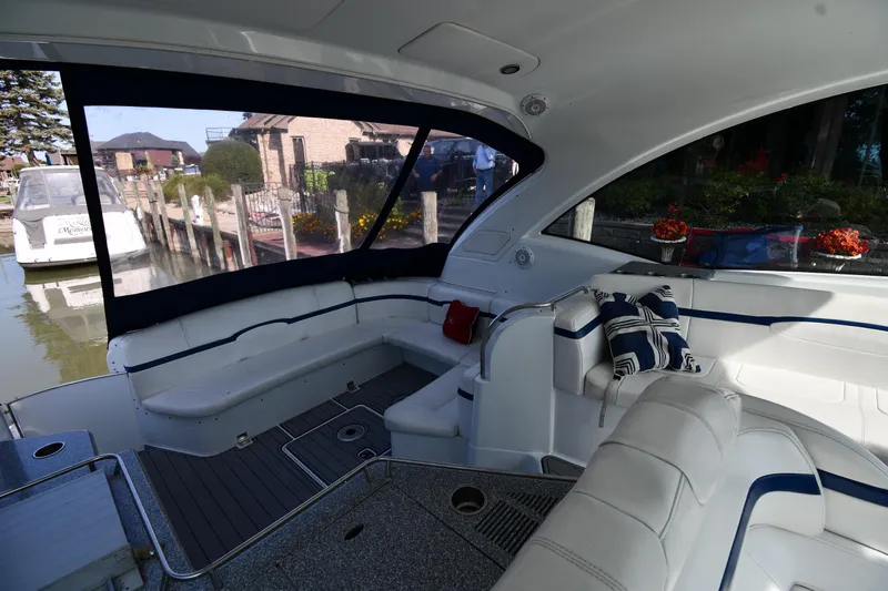  Yacht Photos Pics Luxurious interior of a 2007 Formula 45 Yacht with plush seating and scenic marina view.